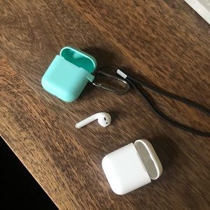 Authentic Apple AirPod (left) and Charger